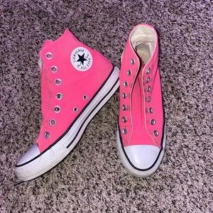 Bright pink Converse all stars